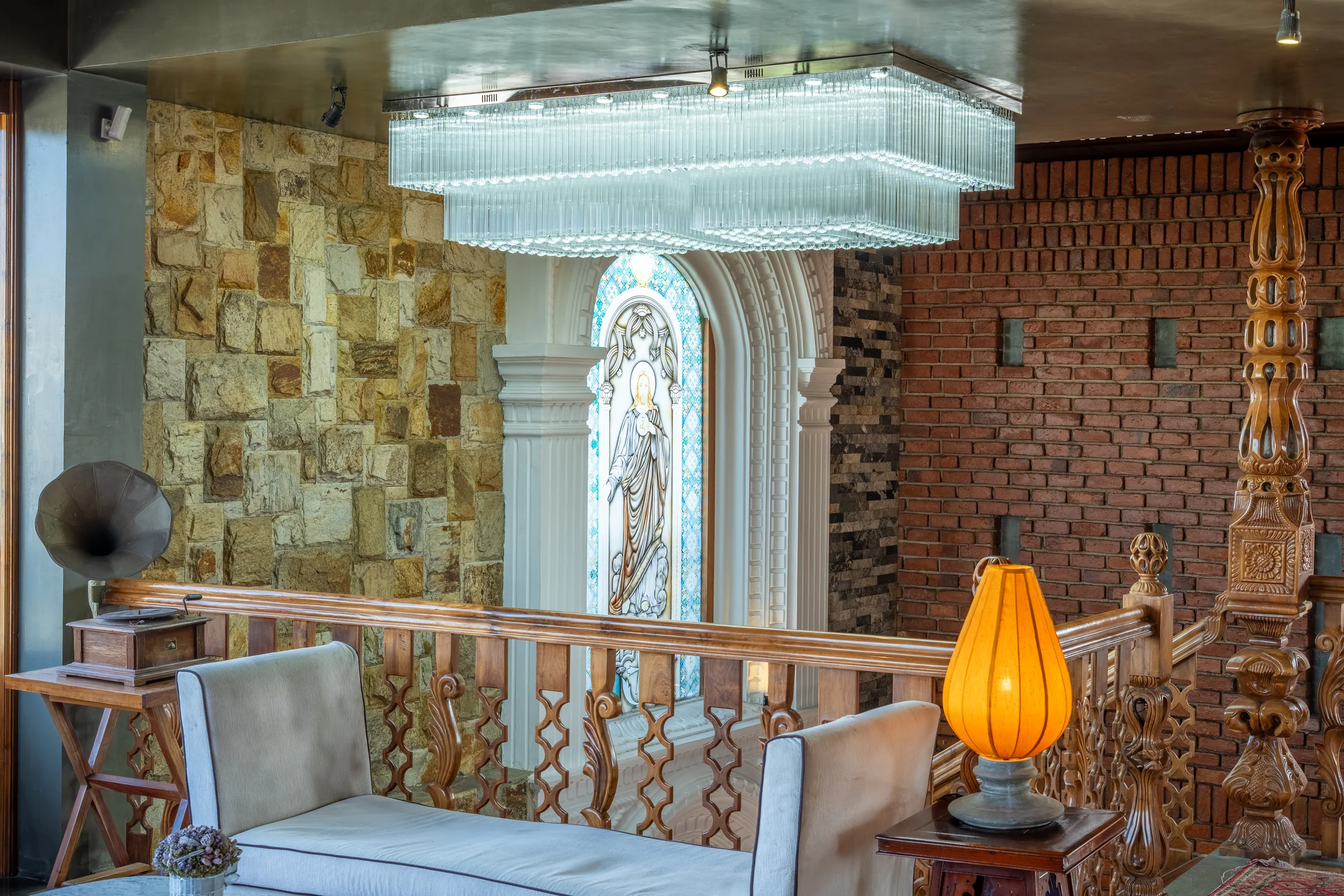 Living and dining area connected by full-height glass doors